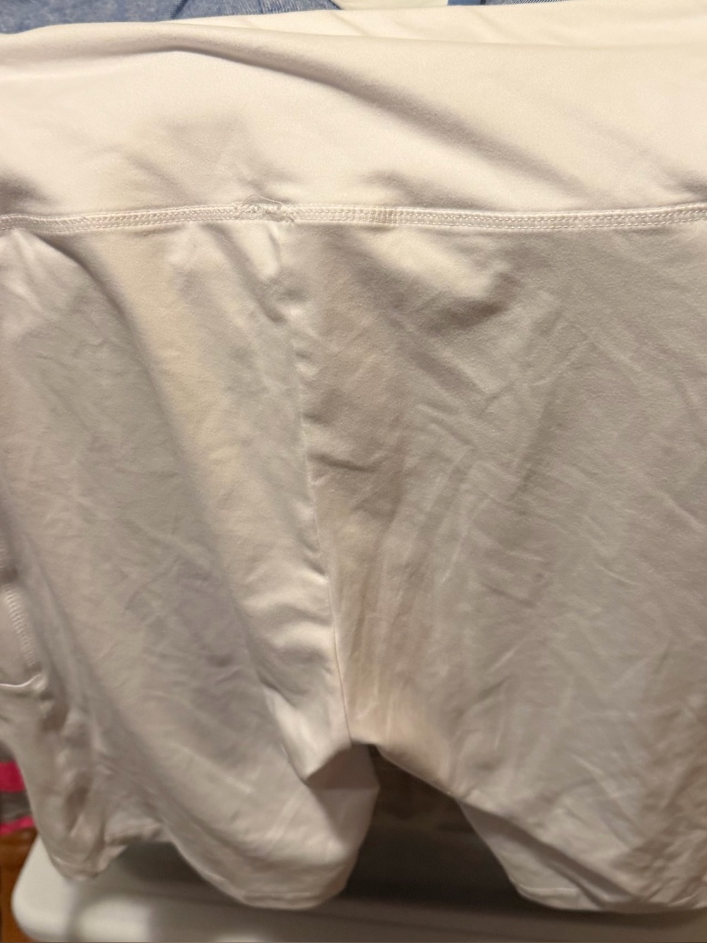 high-waisted white athletic bike shorts.